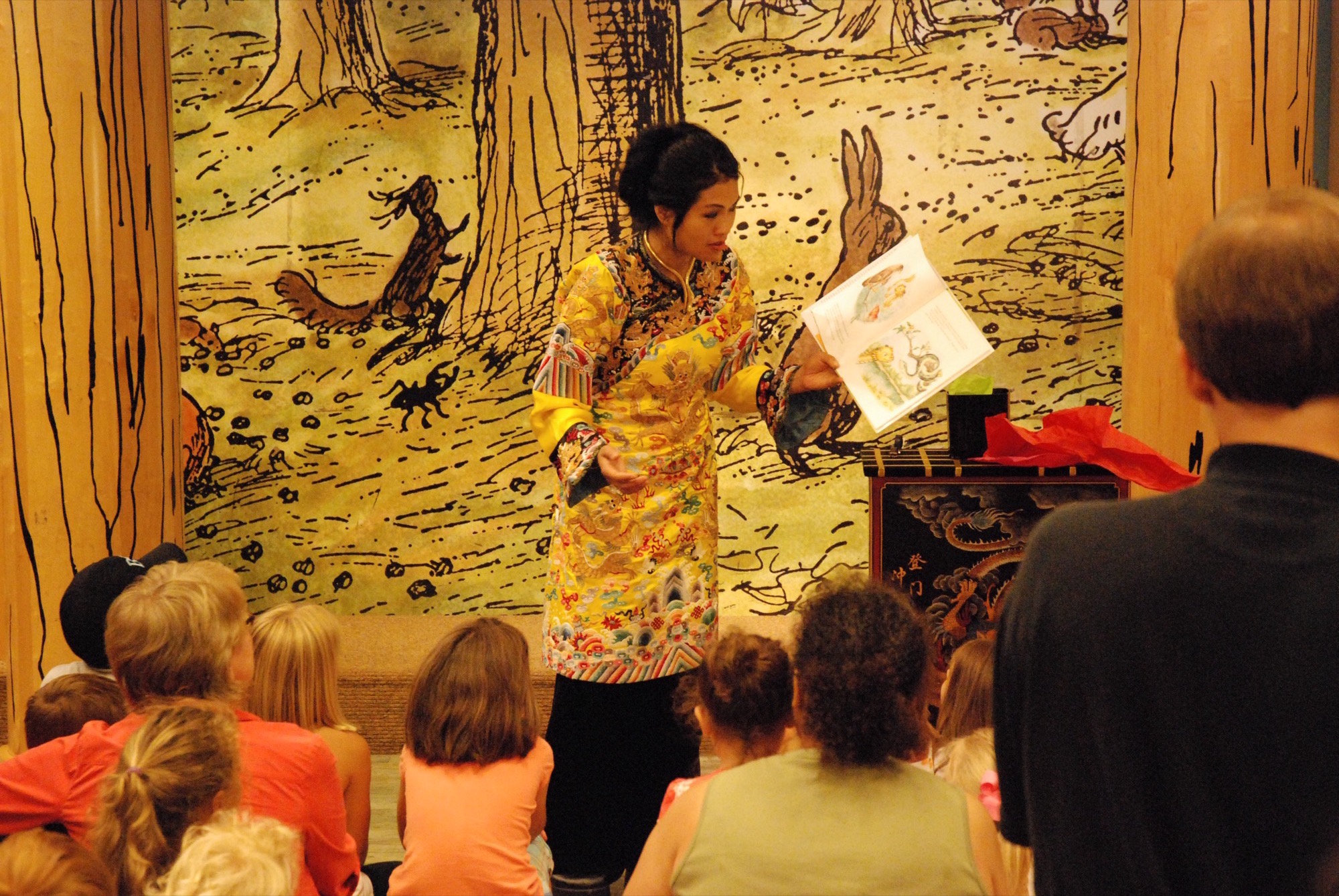 Grace Chang performing a costumed book reading for children at Barnes and Noble