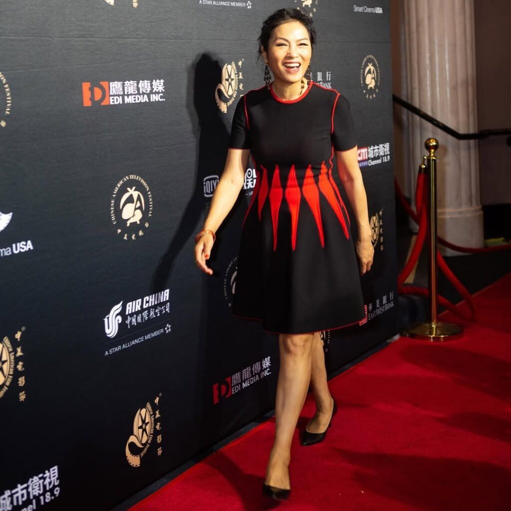 Grace Chang at red carpet premiere in black and red gown