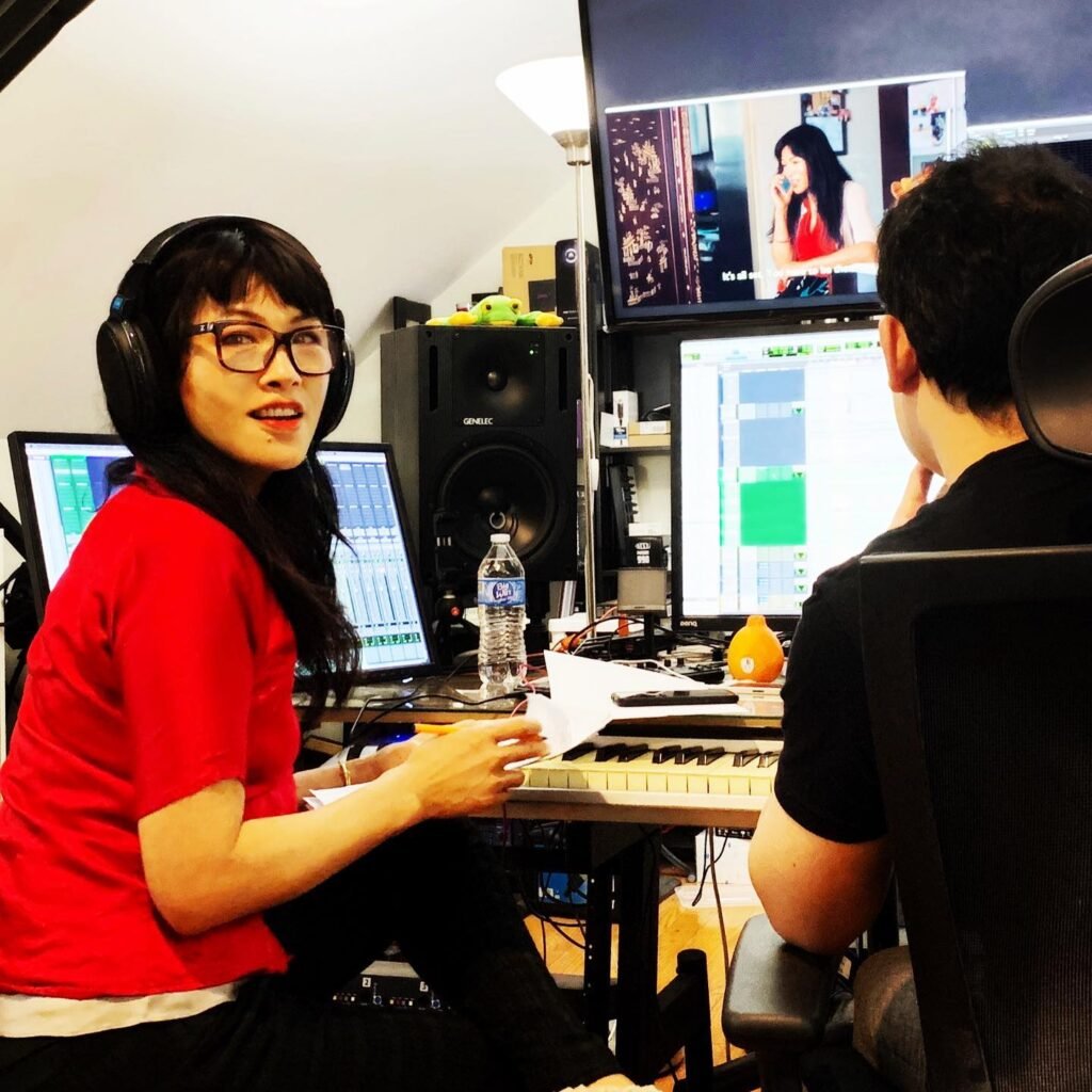 Grace Chang in recording studio directing a production