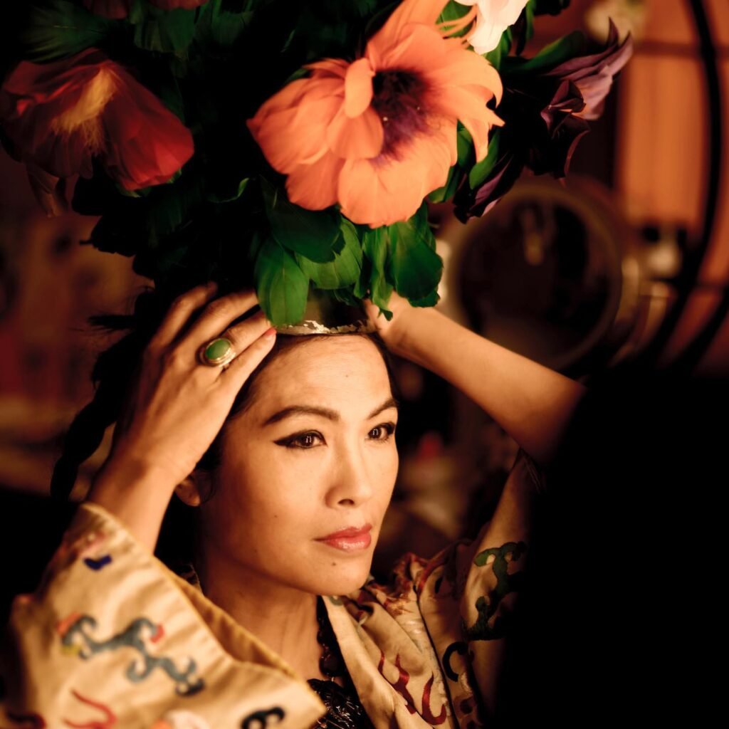 Grace Chang wearing a floral headpiece, portrait photograph